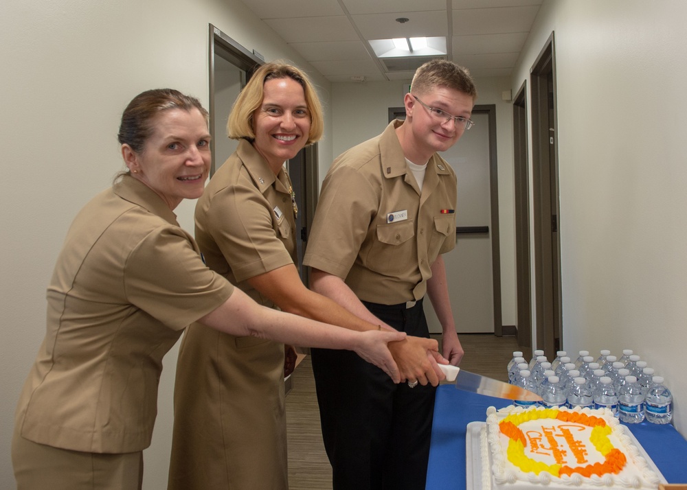 Sailors cut cake