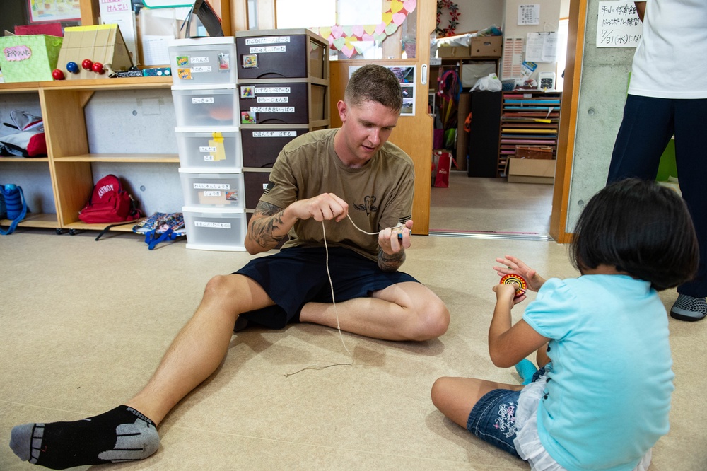 Junior Sailor Association volunteer at Children's Center of Okinawa