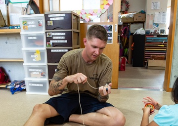 Junior Sailor Association volunteer at Children's Center of Okinawa