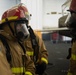 U.S. Navy Sailors complete a drill in the hangar bay of the aircraft carrier USS John C. Stennis