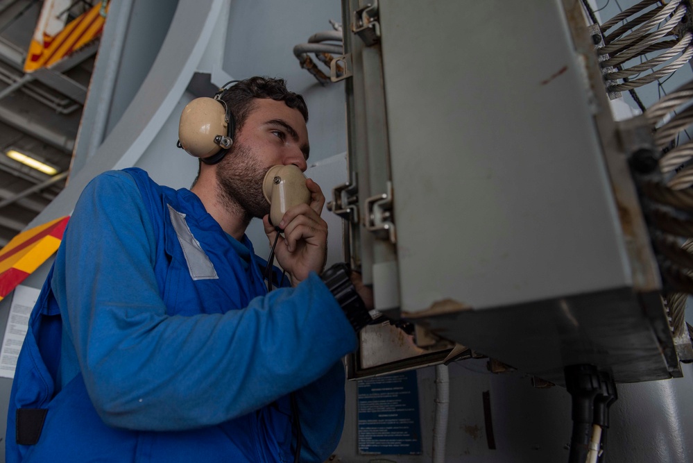 U.S. Sailor uses a sound-powered phone