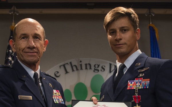 COMACC presents BSM to 38th RQS Airman