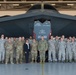 Vice Admiral Dave Kriete stands with members of Team Whiteman in front of a B-2 Spirit Bomber after a Dock Tour