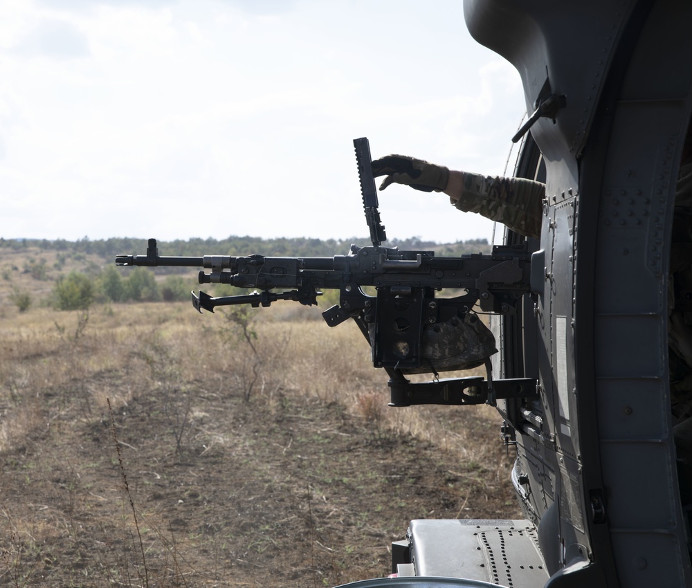 UH-60 Black Hawk helicopter and M240H machine gun 