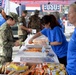 Bob Hope United Service Organization (USO) Members Serve Lunch