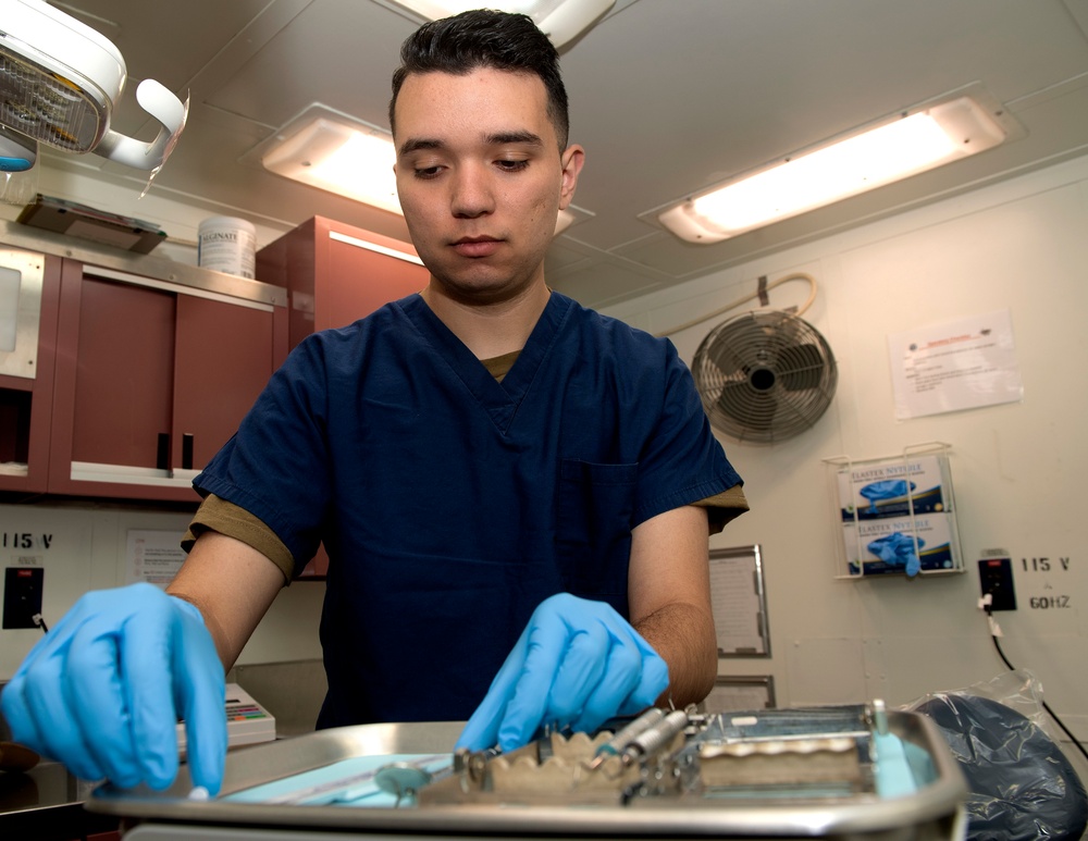 Nimitz Sailors Prepares Dental Examination Room