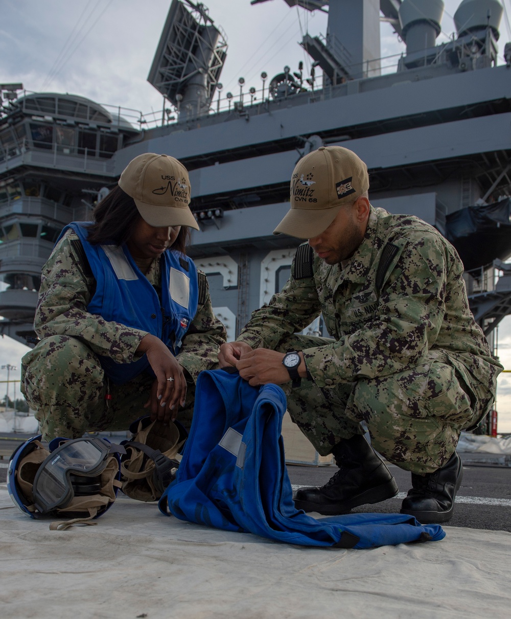 Nimitz Sailors Inspect Float Coat