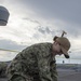 Nimitz Sailor Cleans Pad Eye