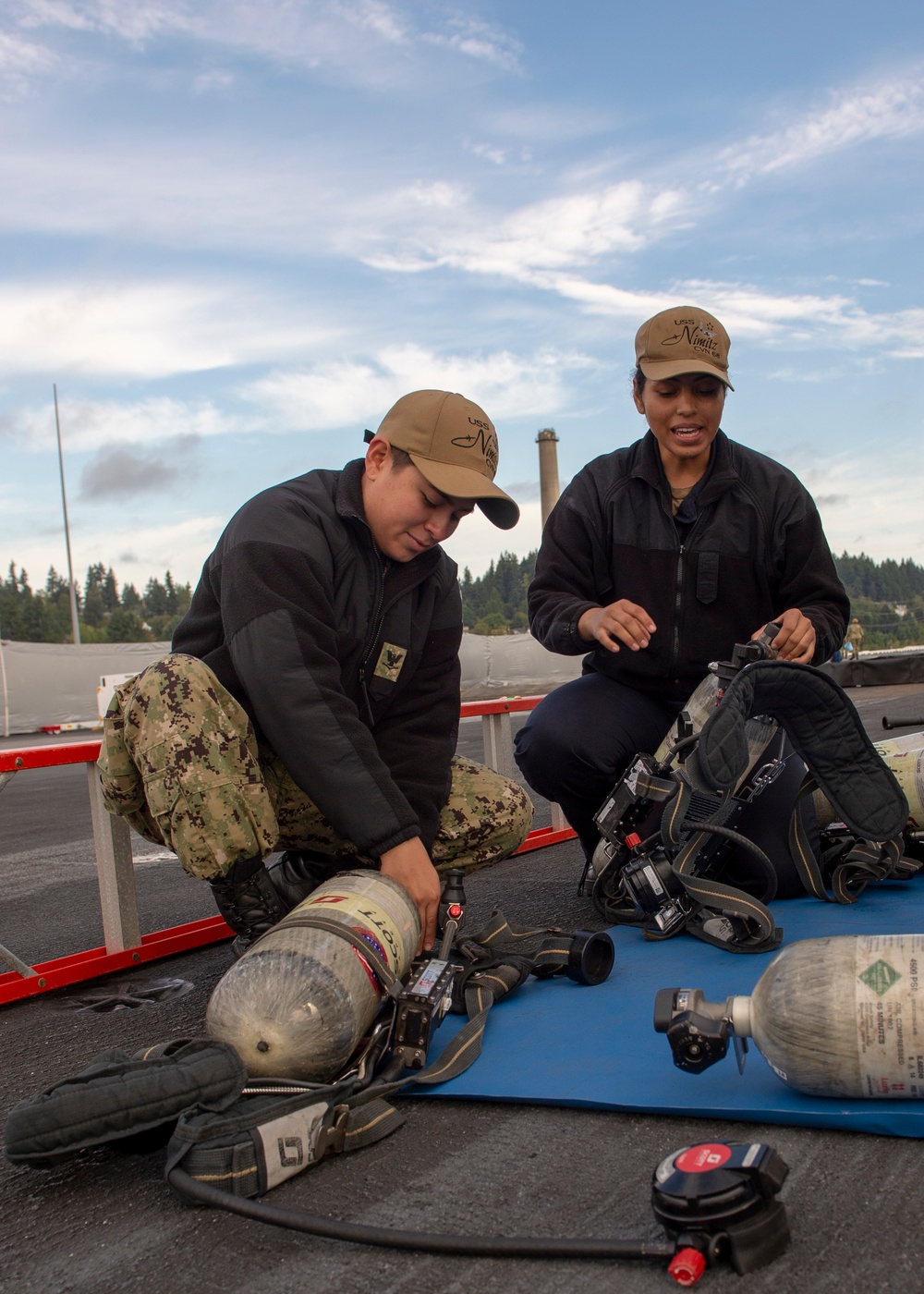 Nimitz Sailors Inspect Self Contained Breathing Apparatus
