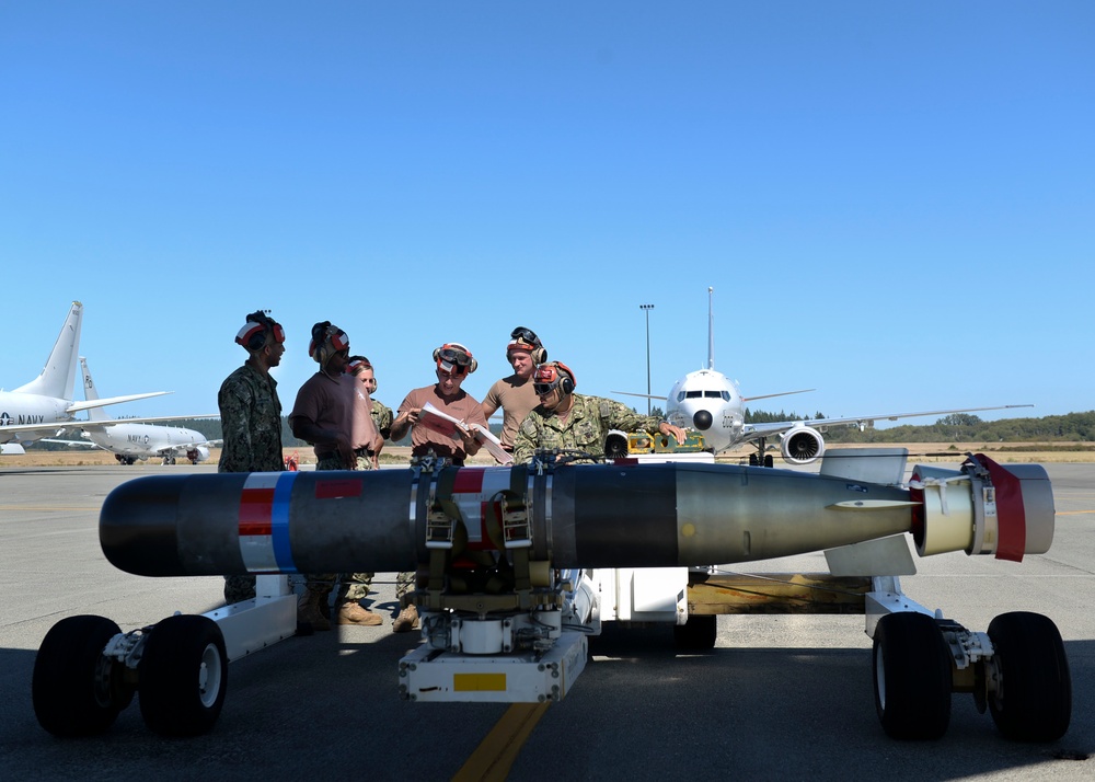 VP-4 Ordnance Team Loads Torpedo