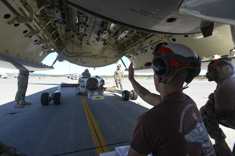 VP-4 Ordnance Team Loads Torpedo