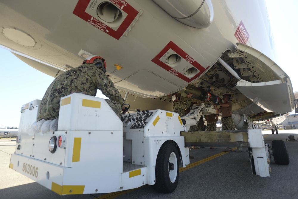 VP-4 Ordnance Team Loads Torpedo
