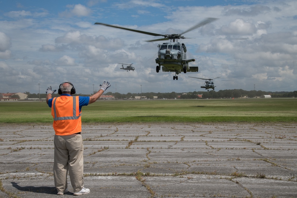 Maxwell AFB receives Navy MH-60R helicopters from Naval Air Station Jacksonville and Naval Station Mayport in advance of Hurricane Dorian