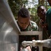 Timor-Leste Defense Force soldiers test potable water during Hari'i Hamutuk 2019