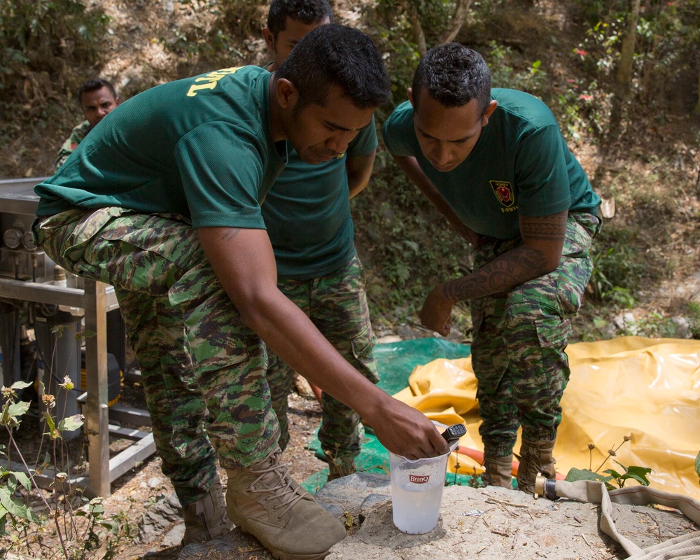 Timor-Leste Defense Force soldiers test potable water during Hari'i Hamutuk 2019