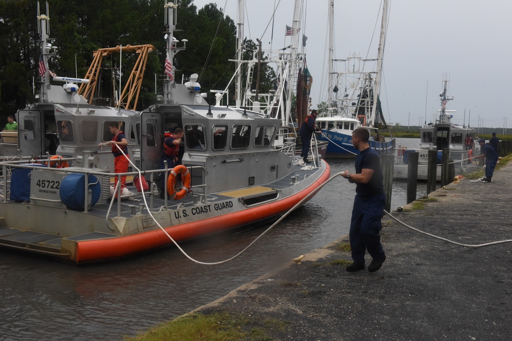 Crewmembers from Coast Guard Stations Charleston and Georgetown secure a 45-foot response boat