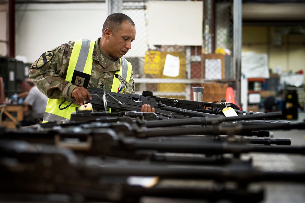 Soldier verifies weapons readiness