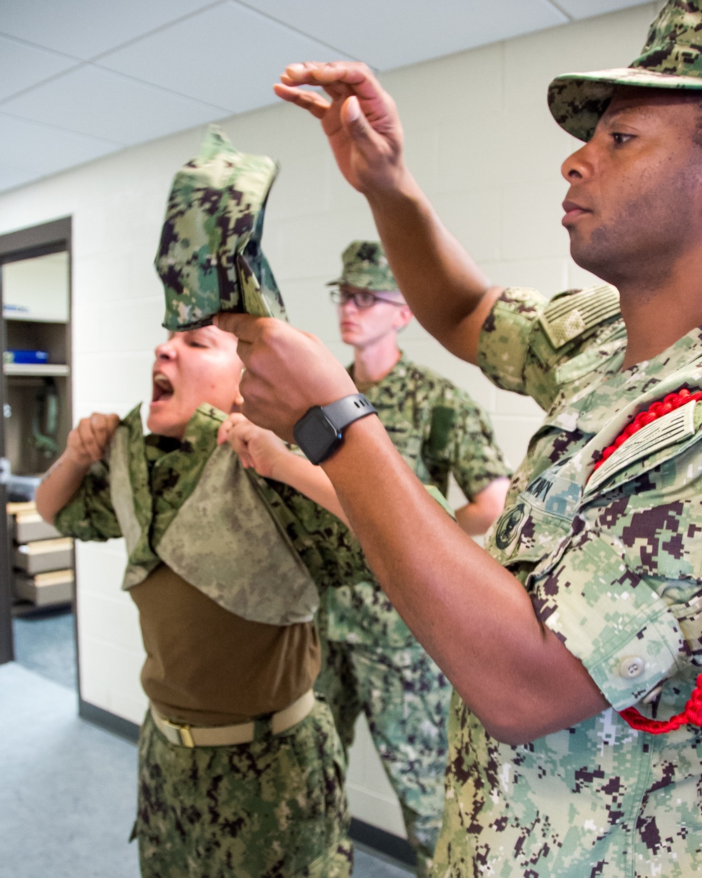 Recruit Division Commanders here at Officer Training Command in Newport, Rhode Island (OTCN) inspects uniforms as part of the Room, Locker and Personnel (RLP) inspection for Officer Candidate School (OCS) class 02-20 on Sept. 5, 2019.