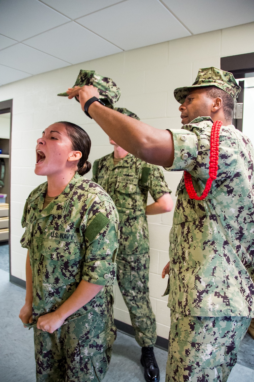 Recruit Division Commanders here at Officer Training Command in Newport, Rhode Island (OTCN) inspects uniforms as part of the Room, Locker and Personnel (RLP) inspection for Officer Candidate School (OCS) class 02-20 on Sept. 5, 2019.