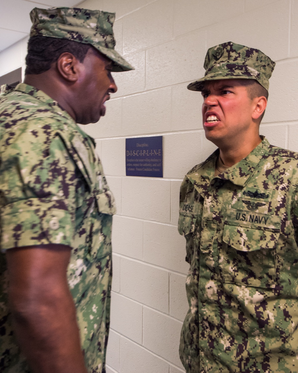 Recruit Division Commanders here at Officer Training Command in Newport, Rhode Island (OTCN) inspects uniforms as part of the Room, Locker and Personnel (RLP) inspection for Officer Candidate School (OCS) class 02-20 on Sept. 5, 2019.