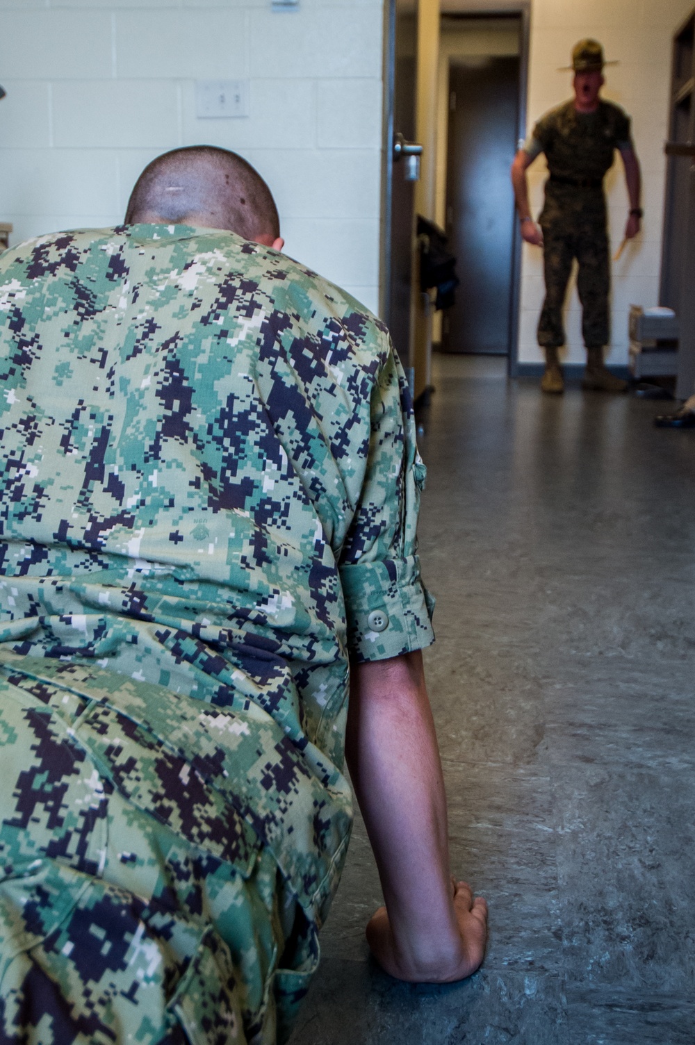 A Marine Corps Drill Instructor (DI) here at Officer Training Command in Newport, Rhode Island (OTCN) conducts a room inspection as part of the Room, Locker and Personnel (RLP) inspection for Officer Candidate School (OCS) class 02-20 on Sept. 5, 2019.