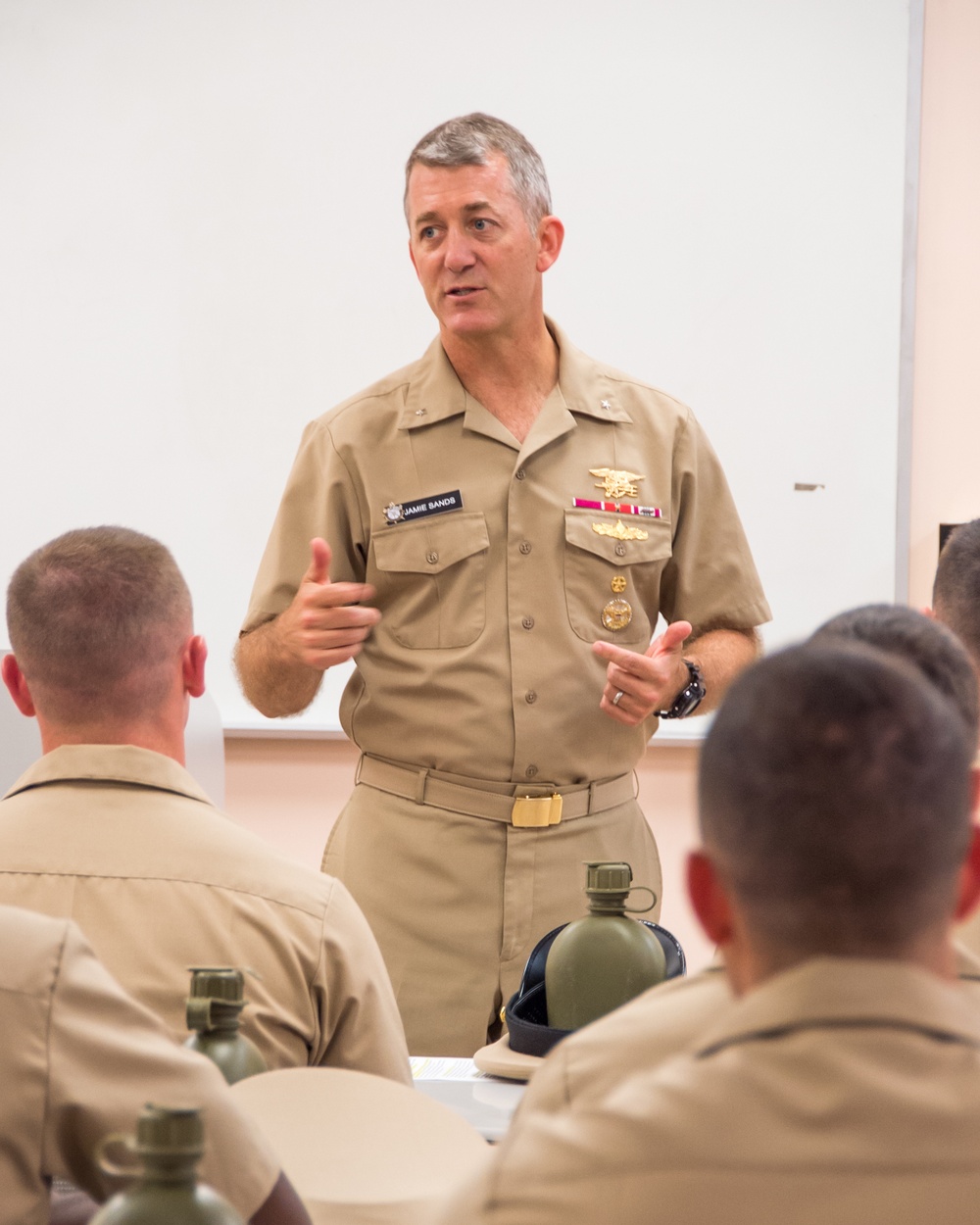 190905-N-TE695-0017 NEWPORT, R.I. (Sept. 5, 2019) – Rear Adm. Jamie Sands, commander of Naval Service Training Command, speaks with soon to be graduates of Officer Candidate School (OCS) class 16-19 on Sept. 5, 2019.