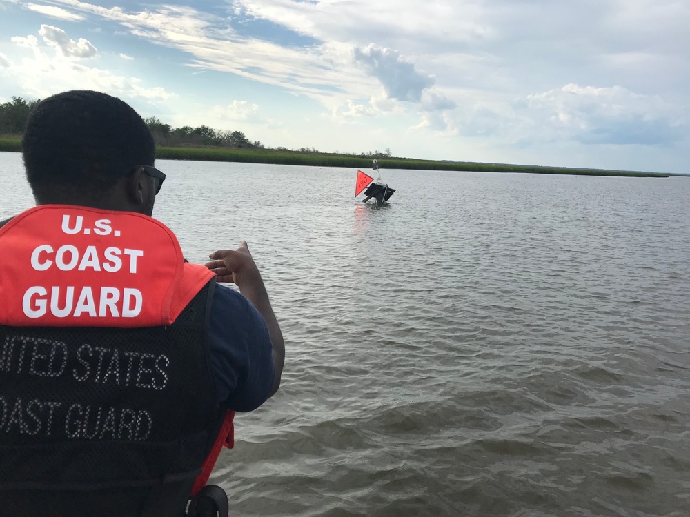 Crewmembers from Coast Guard Station Brunswick, GA assess aids to navigation