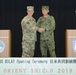 Commander of U.S. Army Japan and Commander of Western Army of the Japan Ground Self-Defense Force shake hands during opening ceremony of OS19
