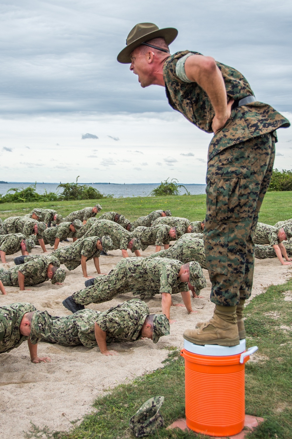 A Marine Corps Drill Instructor, assigned to Officer Training Command, Newport, Rhode Island, (OTCN) leads physical training for Officer Candidate School (OCS) class 02-20 prior to reaching their milestone as junior candidate officers on Sept. 6, 2019.