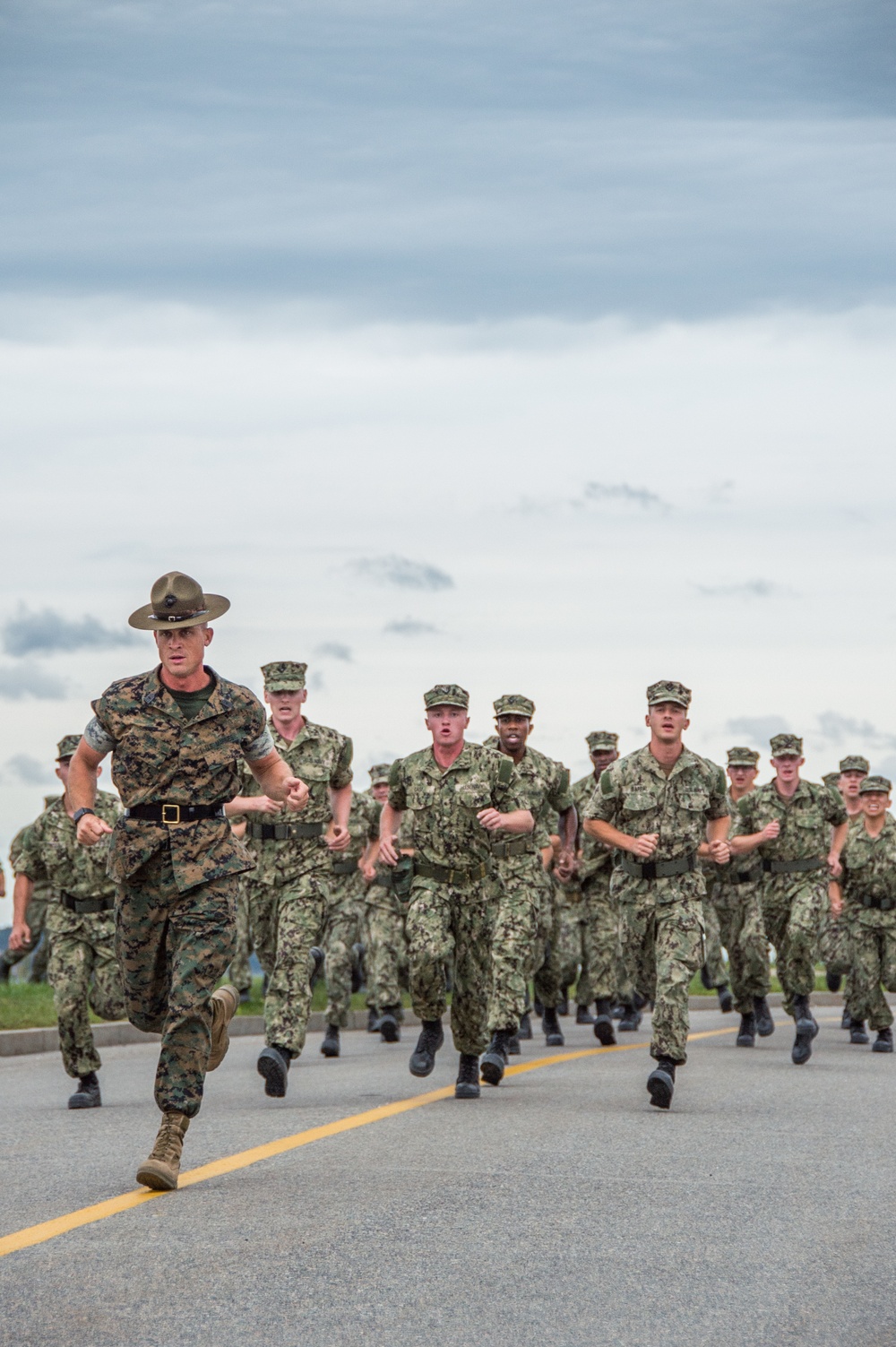 A Marine Corps Drill Instructor, assigned to Officer Training Command, Newport, Rhode Island, (OTCN) leads physical training for Officer Candidate School (OCS) class 02-20 prior to reaching their milestone as junior candidate officers on Sept. 6, 2019.