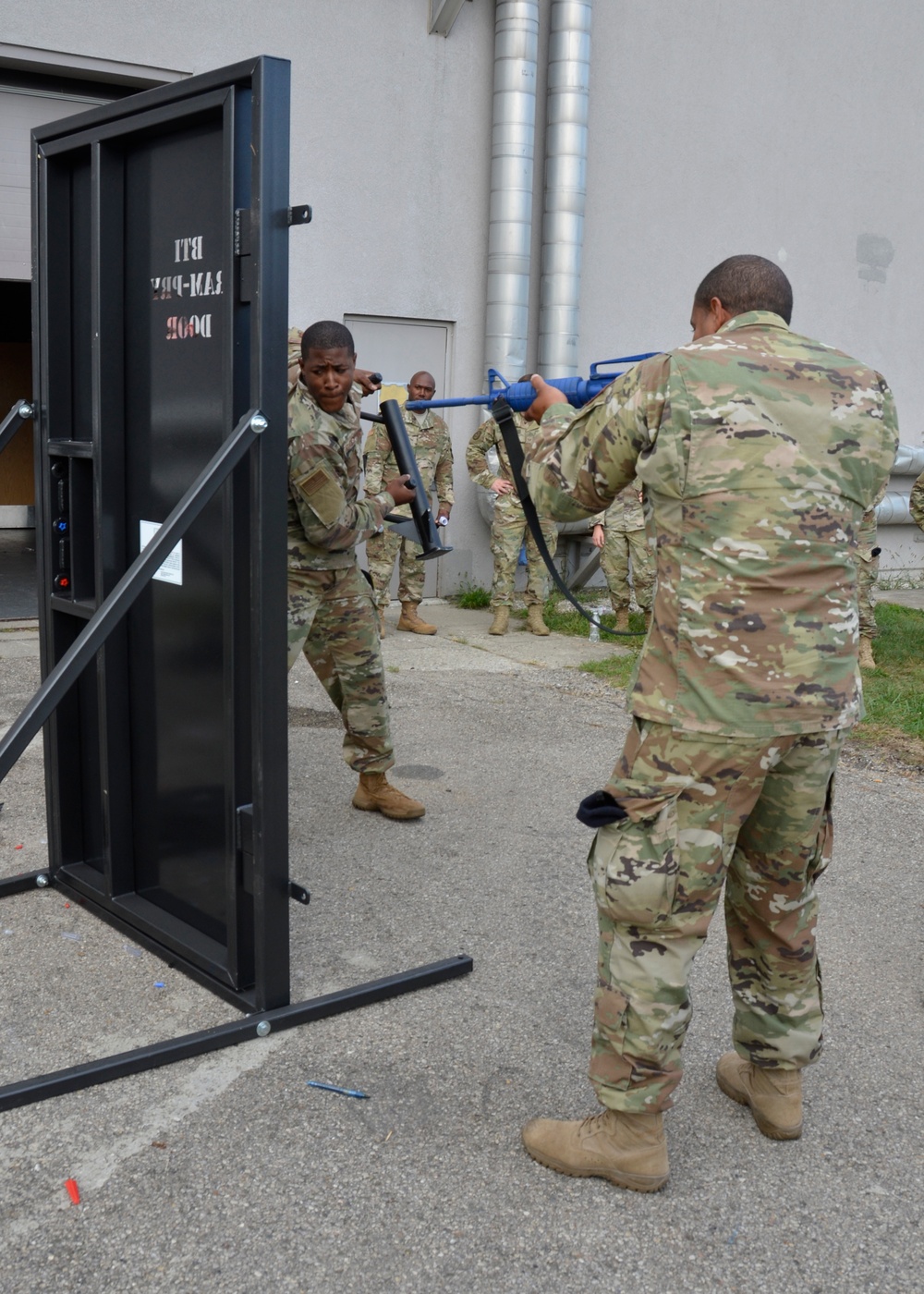 Security Forces Airmen train with specialized tools to force entry