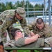 Paratroopers Work on Patient