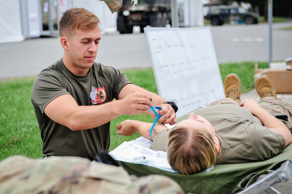 Paratrooper Works on Patient