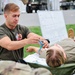 Paratrooper Works on Patient