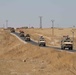 U.S. and Turkish military forces conduct a joint ground patrol inside of the security mechanism in northeast Syria