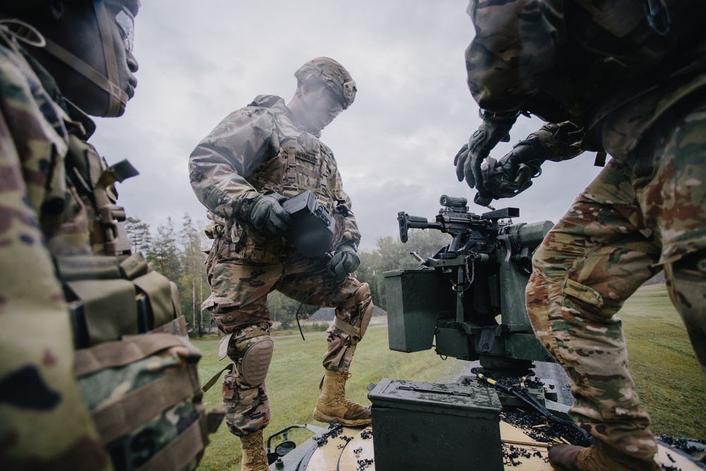 Paratroopers reload weapon