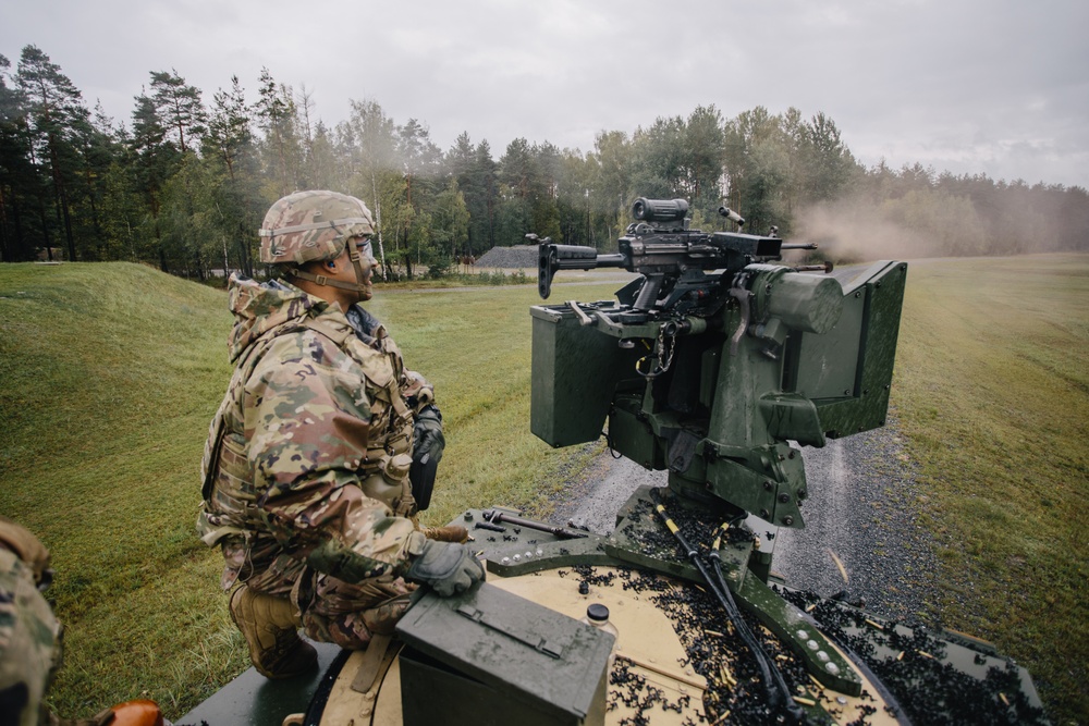 Paratroopers fire weapon
