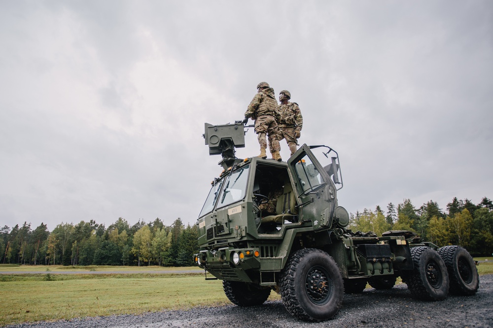 Paratroopers fire weapon