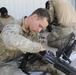 Lancer Brigade Soldier Cleans his rifle before live-fire at NTC
