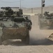 Lancer Brigade Soldiers move out in their Strykers at NTC