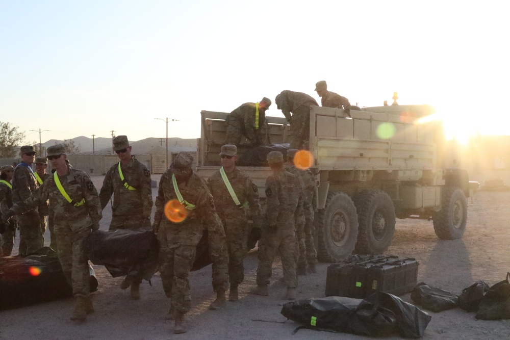 Lancer Soldiers unload equipment to start constructing the command post