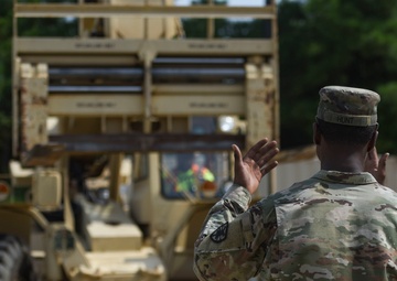 Soldiers unload cargo of knowledge to local dockworkers