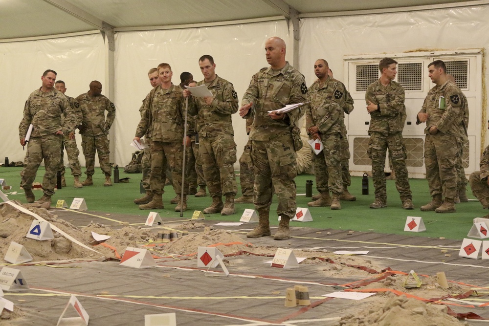 Lancer Soldiers participate in a Combined Arms Rehearsal during NTC