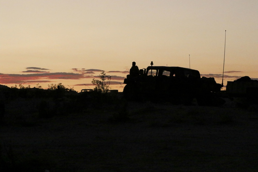 Lancer Soldier watches sunset at NTC