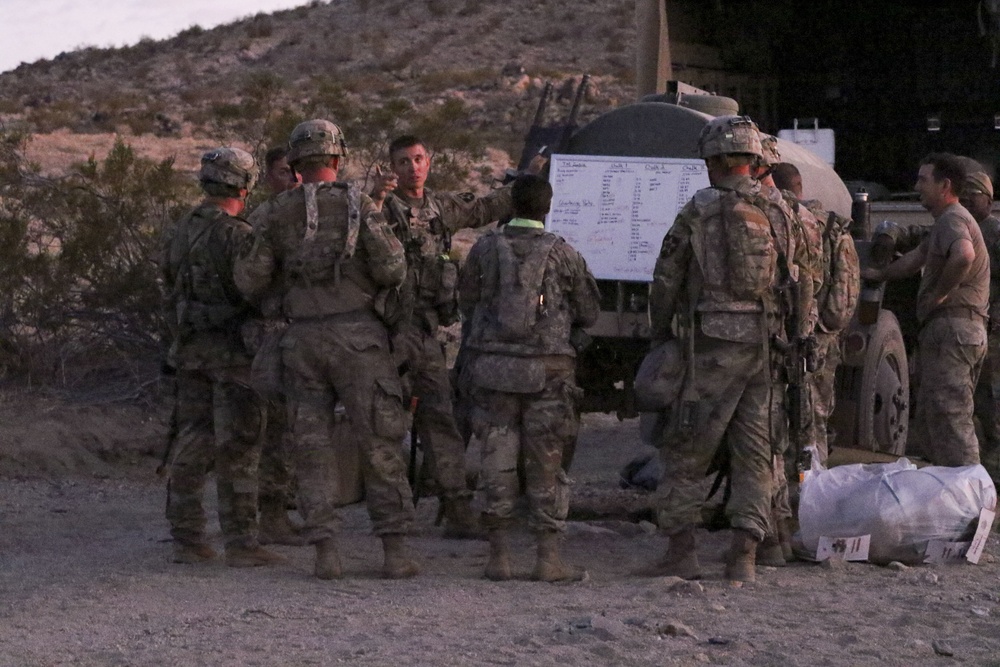 Lancer Soldiers attend convoy brief at NTC