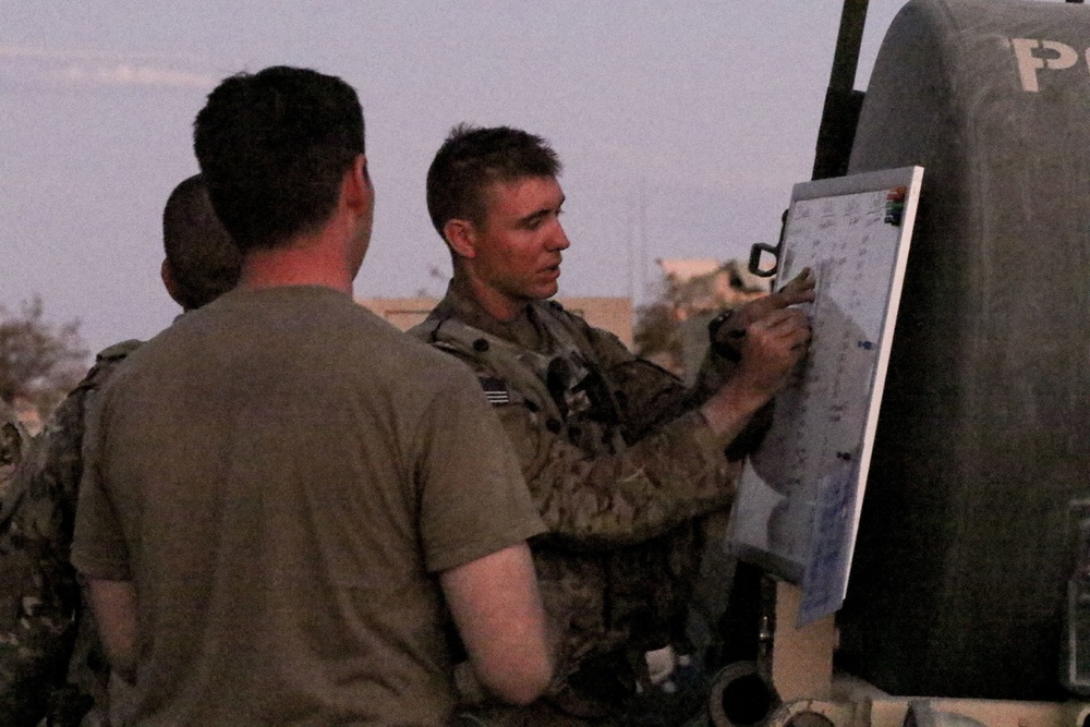 HHC Commander Cpt. Thomas Dickson gives convoy brief at NTC