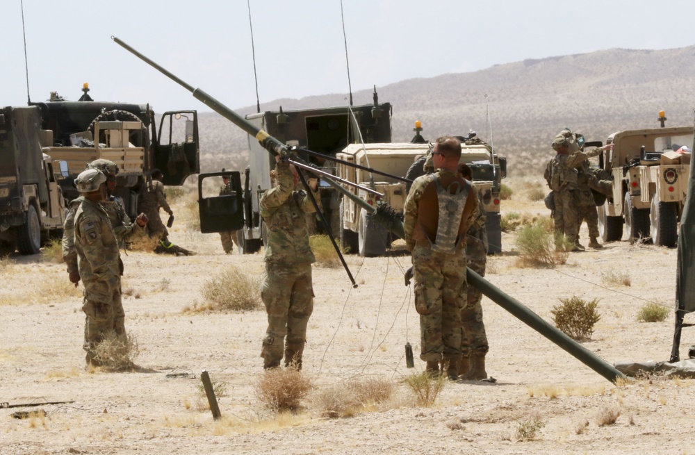 Lancer Soldiers set up communications for command post at NTC