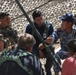 Col. Jonathan Chung speaks with training actors during a Key Leader Engagement at NTC