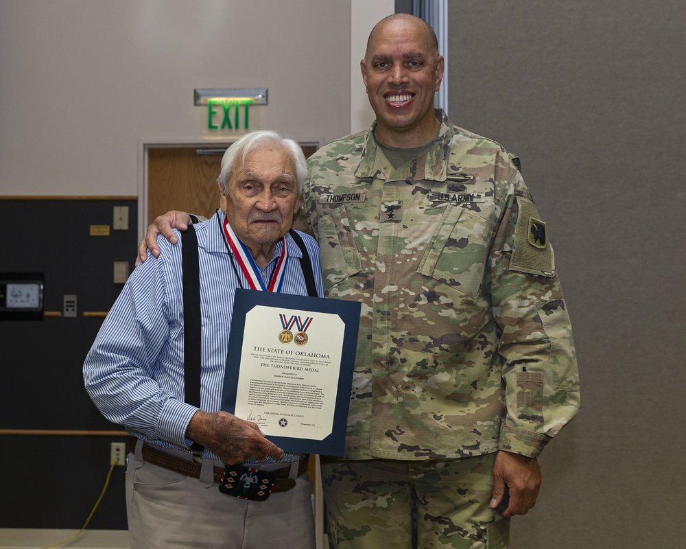 Maj. Gen. Thompson presents the Thunderbird Medal to Warrior Charles Coleman