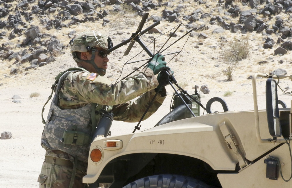 Civil Affairs Soldier sets up communications for IDP mission at NTC